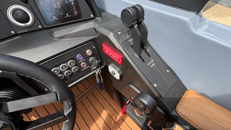 Slide: The Image of Control panel of 2025 MB B52 23 Alpha boat with steering wheel and dashboard. - 28