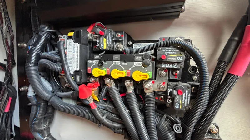 Slide: The Image of Electrical wiring and circuit breakers in MB B52 23 Alpha, 2025 model. - 37