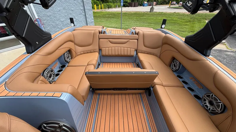 Slide: The Image of Luxurious interior of 2025 MB B52 23 Alpha boat with tan seating and premium speakers. - 42
