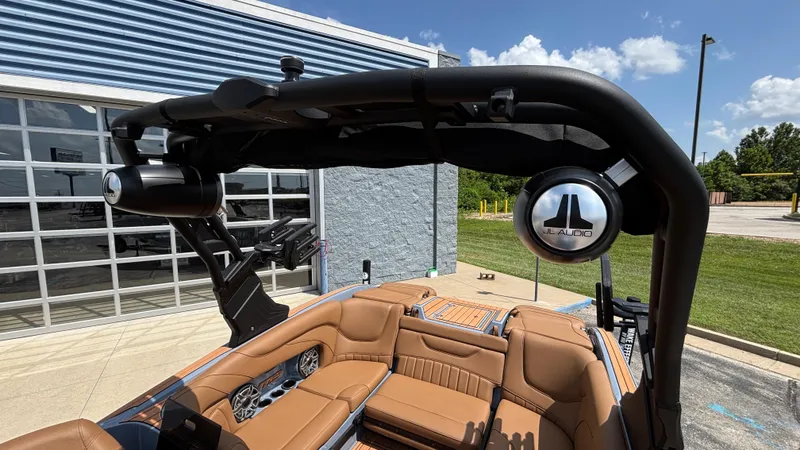 Slide: The Image of 2025 MB B52 23 Alpha boat with JL Audio speakers and luxurious seating. - 9