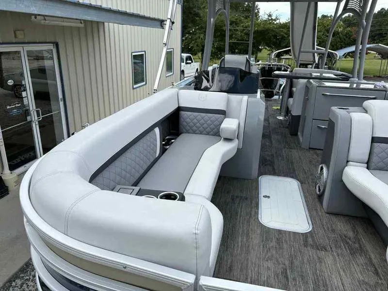 Slide: The Image of 2023 Godfrey AquaPatio 255 SDC pontoon boat with luxurious seating and modern design. - 17