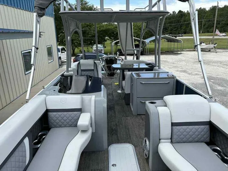 Slide: The Image of 2023 Godfrey AquaPatio 255 SDC pontoon boat with luxurious seating and modern amenities. - 22