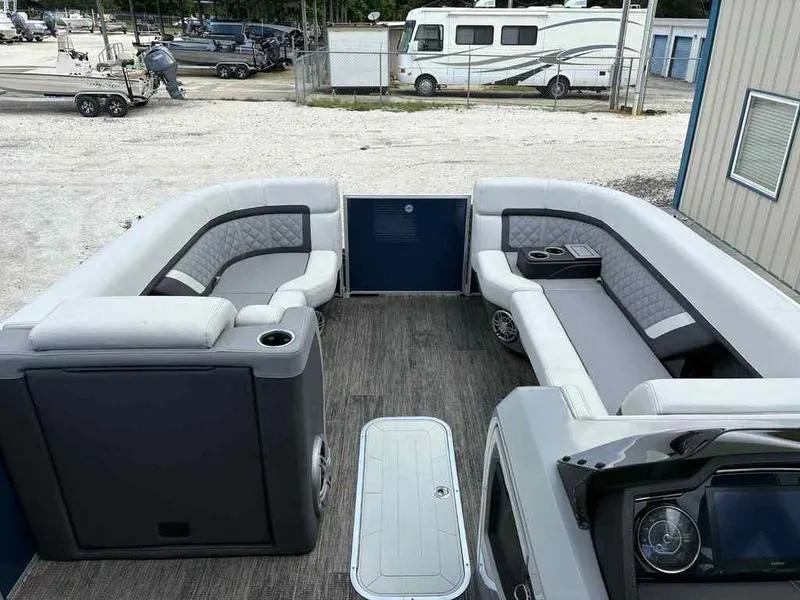 Slide: The Image of 2023 Godfrey AquaPatio 255 SDC pontoon boat interior with luxurious seating and modern design. - 24