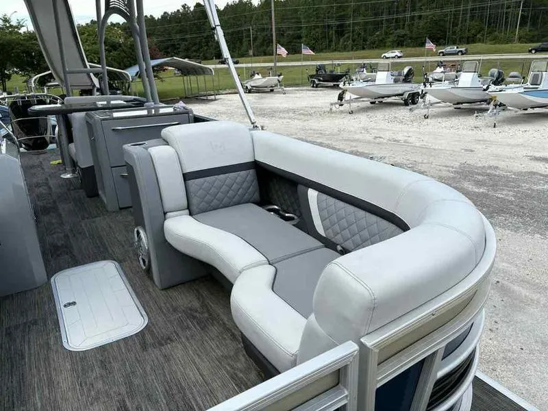 Slide: The Image of 2023 Godfrey AquaPatio 255 SDC pontoon boat with luxurious seating and modern design. - 27