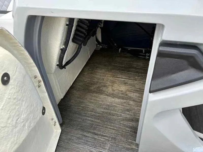 Slide: The Image of Interior storage compartment of 2023 Godfrey AquaPatio 255 SDC boat. - 34