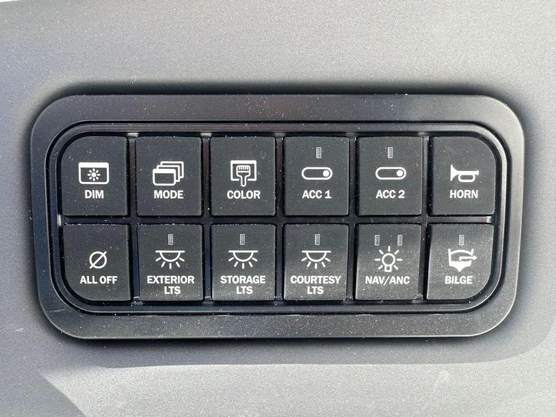 Slide: The Image of Control panel of 2024 Tahoe 210 S boat with various function buttons. - 2