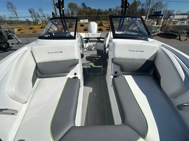 Slide: The Image of 2024 Tahoe 210 S boat interior with white and gray seating. - 3