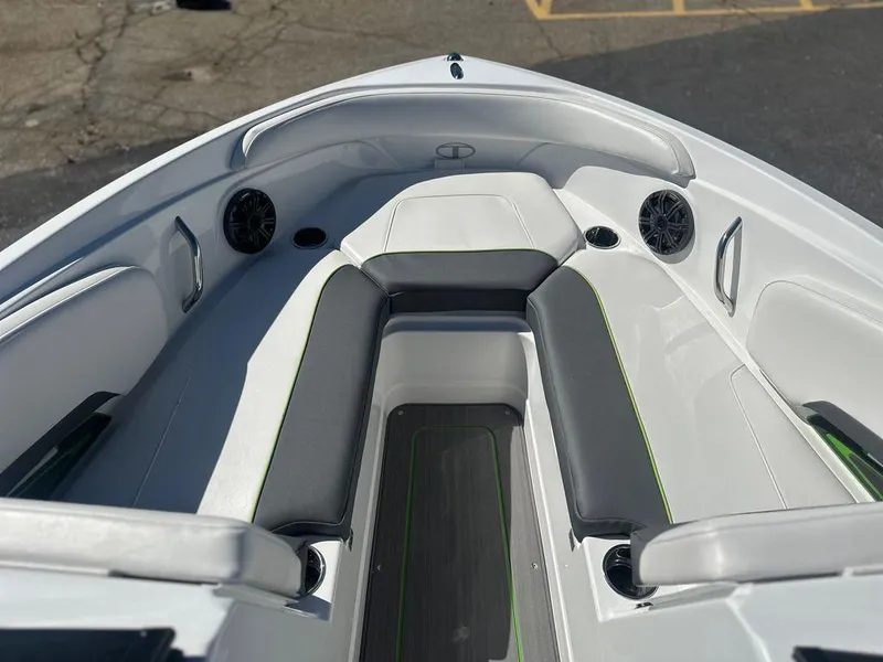Slide: The Image of 2024 Tahoe 210 S boat interior with cushioned seating and built-in speakers. - 5