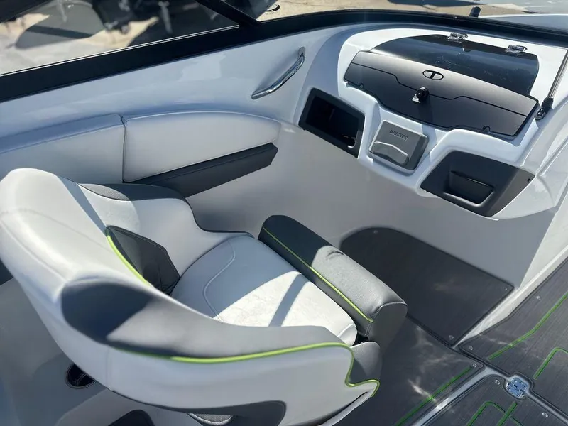 Slide: The Image of 2024 Tahoe 210 S boat interior with modern seating and dashboard. - 6
