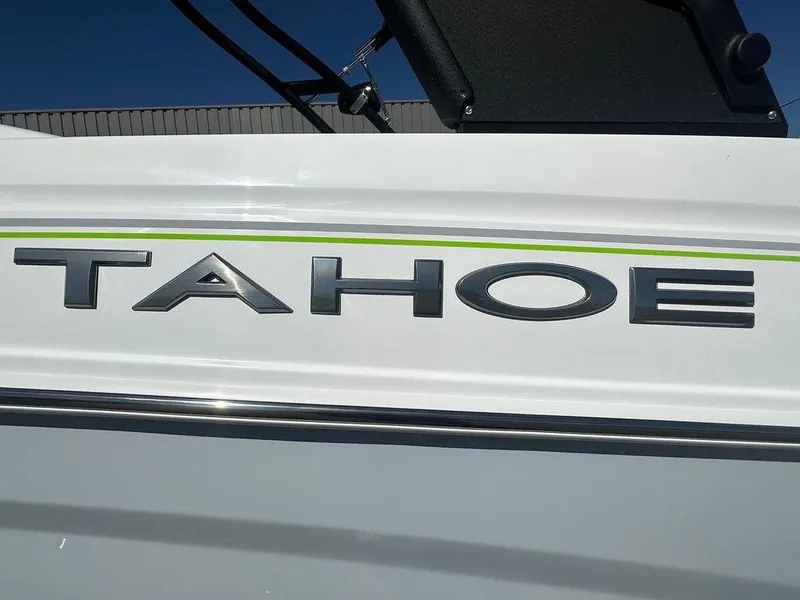 Slide: The Image of 2024 Tahoe 210 S boat logo on white exterior. - 8