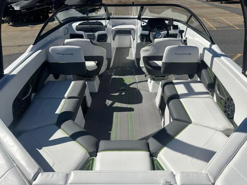 Slide: The Image of 2024 Tahoe 210 S boat interior with white and gray seating. - 9