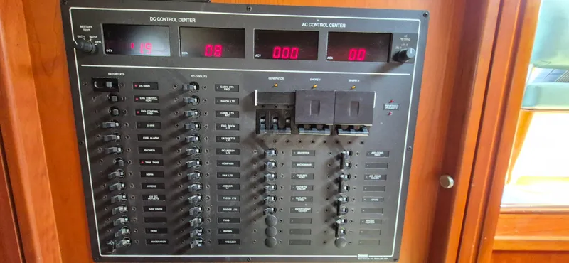 Slide: The Image of Electrical control panel on a 1997 Able 44 Downeast Express Cruiser boat. - 11