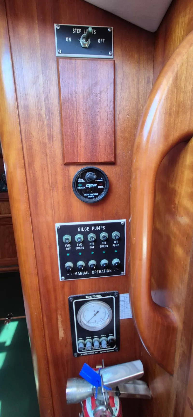 Slide: The Image of Control panel on 1997 Able 44 Downeast Express Cruiser with bilge pump switches and gauges. - 12