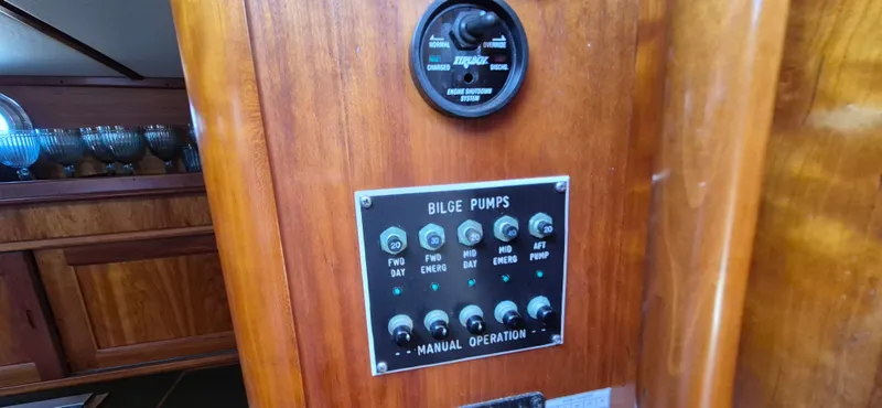 Slide: The Image of Control panel for bilge pumps on a 1997 Able 44 Downeast Express Cruiser. - 14