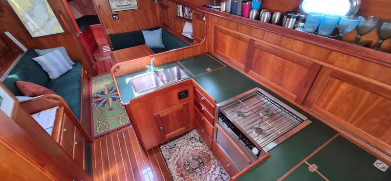 Slide: The Image of Interior of 1997 Able 44 Downeast Express Cruiser with wood finish and compact kitchen. - 21