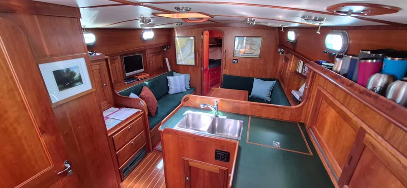 Slide: The Image of Interior of 1997 Able 44 Downeast Express Cruiser with wood finish and cozy seating area. - 22