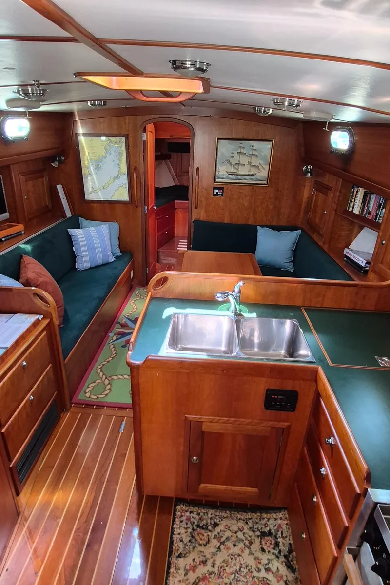 Slide: The Image of Interior of 1997 Able 44 Downeast Express Cruiser with wood finish and cozy seating area. - 23