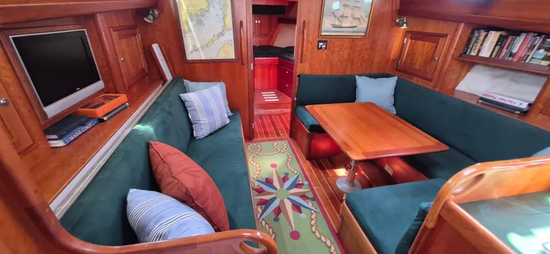Slide: The Image of Interior of 1997 Able 44 Downeast Express Cruiser with cozy seating and nautical decor. - 24