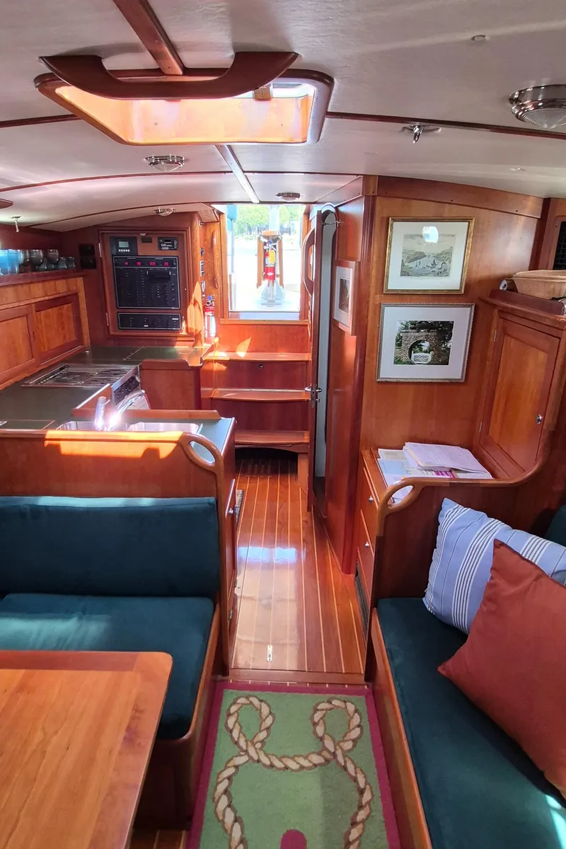 Slide: The Image of Interior of 1997 Able 44 Downeast Express Cruiser with wood finish and cozy seating area. - 25