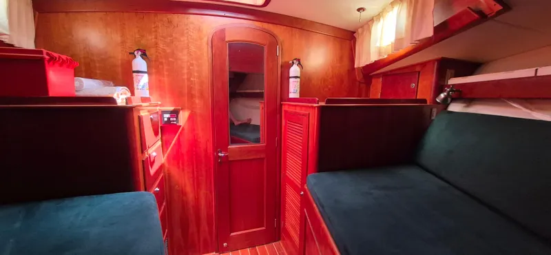Slide: The Image of Interior of 1997 Able 44 Downeast Express Cruiser with wooden finish and seating area. - 28