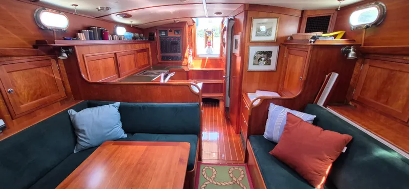 Slide: The Image of Interior of 1997 Able 44 Downeast Express Cruiser with wood finish and cozy seating area. - 30