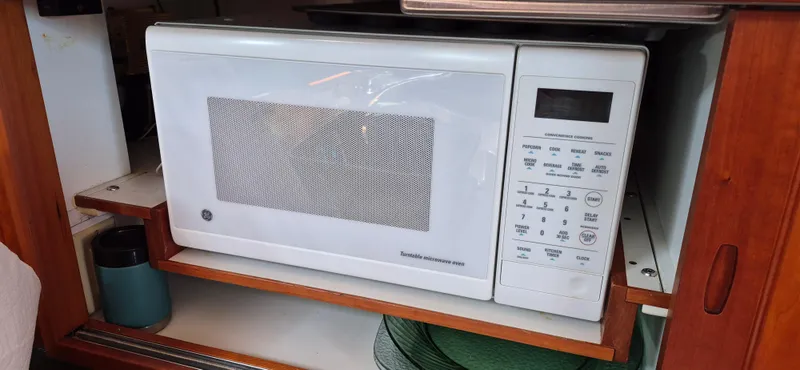Slide: The Image of Microwave oven in a 1997 Able 44 Downeast Express Cruiser kitchen setup. - 33