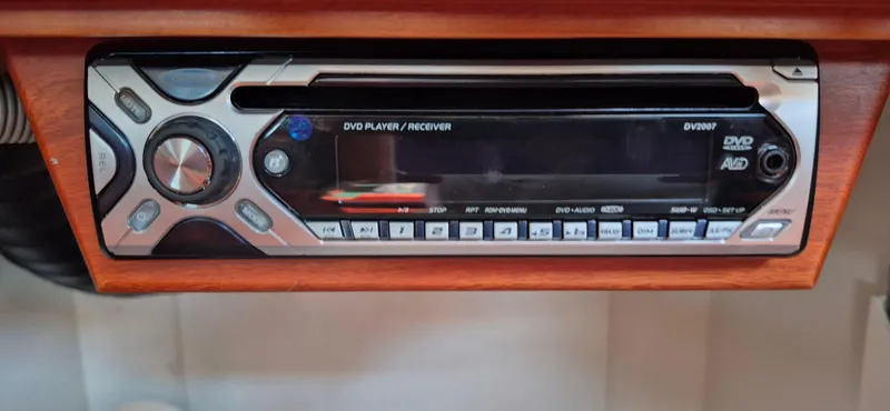Slide: The Image of DVD player/receiver in 1997 Able 44 Downeast Express Cruiser, mounted in wooden panel. - 36