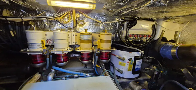 Slide: The Image of Engine room of 1997 Able 44 Downeast Express Cruiser with fuel filters and wiring. - 39