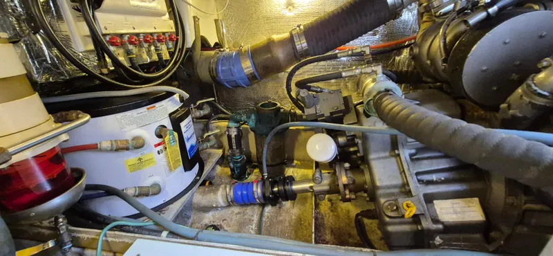 Slide: The Image of Engine room of a 1997 Able 44 Downeast Express Cruiser, showcasing mechanical components and wiring. - 41