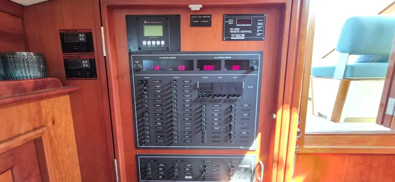 Slide: The Image of Control panel inside a 1997 Able 44 Downeast Express Cruiser, featuring various switches and displays. - 6