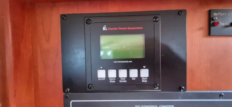 Slide: The Image of Control panel of a Fischer Panda generator on a 1997 Able 44 Downeast Express Cruiser. - 8