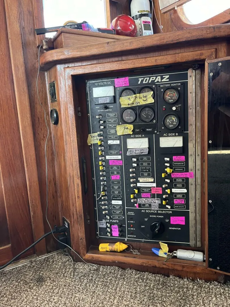 Slide: The Image of Electrical panel of 1989 Topaz Sportfisherman boat with labeled switches and gauges. - 16