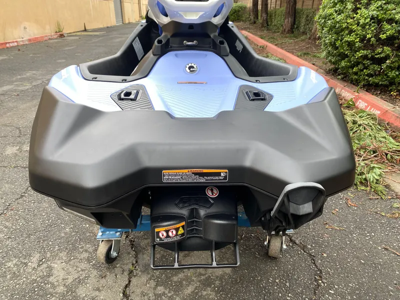 Slide: The Image of 2024 Sea-Doo Spark 3up jet ski rear view on pavement. - 8