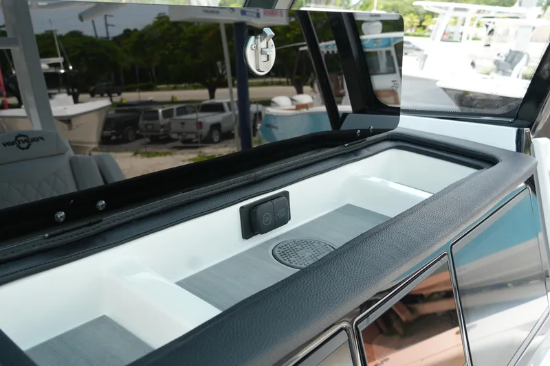 Slide: The Image of 2025 Fountain 38 CC boat interior detail with storage compartment and sleek design. - 20