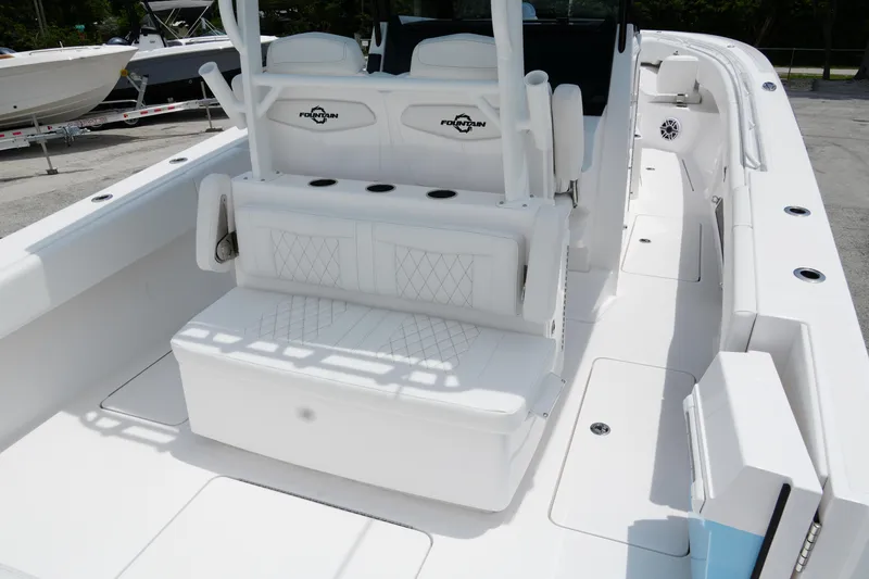 Slide: The Image of 2025 Fountain 38 CC boat interior with white seating and modern design. - 26