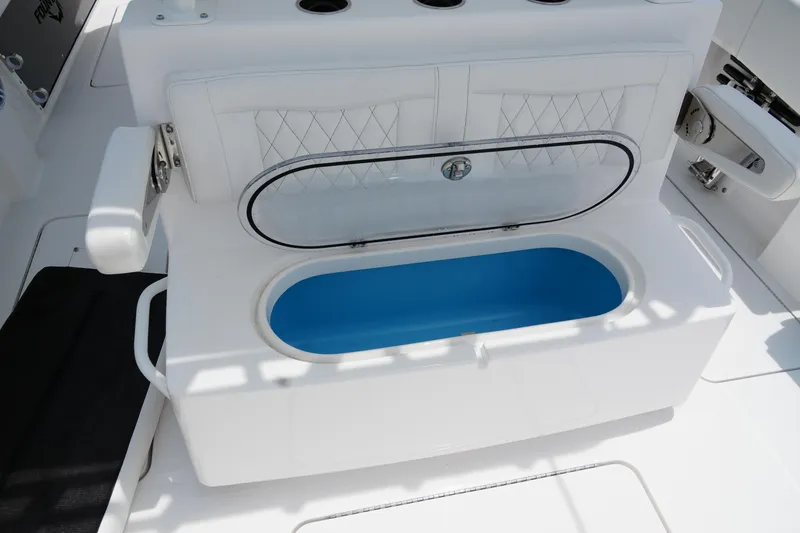 Slide: The Image of 2025 Fountain 38 CC boat interior with open storage compartment. - 29