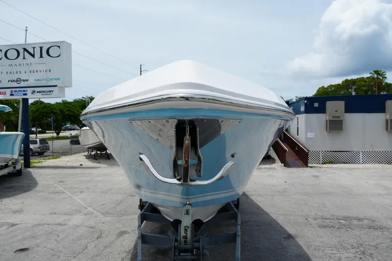 Slide: The Image of 2025 Fountain 38 CC boat displayed at Iconic Marine dealership. - 4