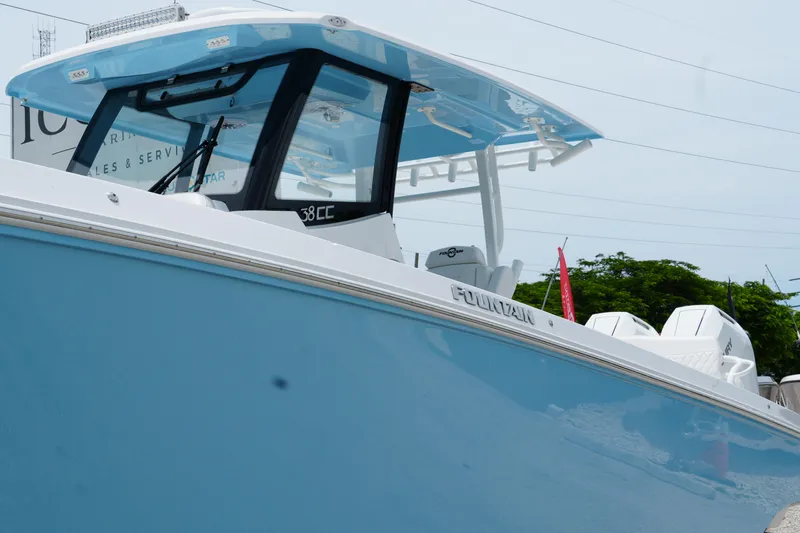 Slide: The Image of 2025 Fountain 38 CC boat with sleek blue hull and modern design. - 5