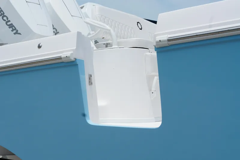 Slide: The Image of 2025 Fountain 38 CC boat with blue and white exterior, featuring Mercury engines. - 6