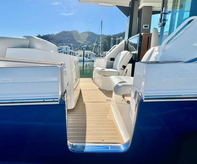 Slide: The Image of 2025 Tiara Yachts 43 LE interior with luxurious seating and sleek design. - 11