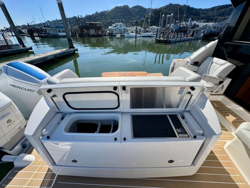 Slide: The Image of 2025 Tiara Yachts 43 LE with open deck storage at marina. - 13