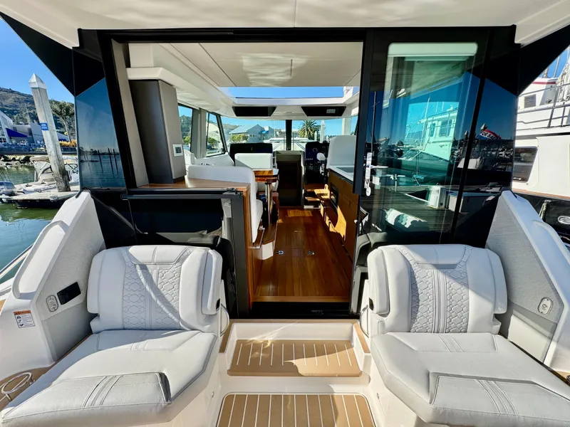 Slide: The Image of 2025 Tiara Yachts 43 LE interior view with luxurious seating and modern design. - 18