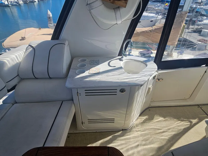 Slide: The Image of Interior of 2012 Silverton West Coast Edition yacht with seating and sink area. - 19