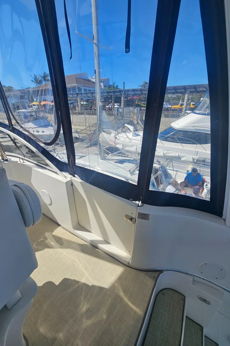 Slide: The Image of Interior view of a 2012 Silverton West Coast Edition yacht docked at a marina. - 20