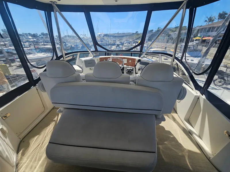 Slide: The Image of Interior view of 2012 Silverton West Coast Edition yacht cockpit with marina background. - 22