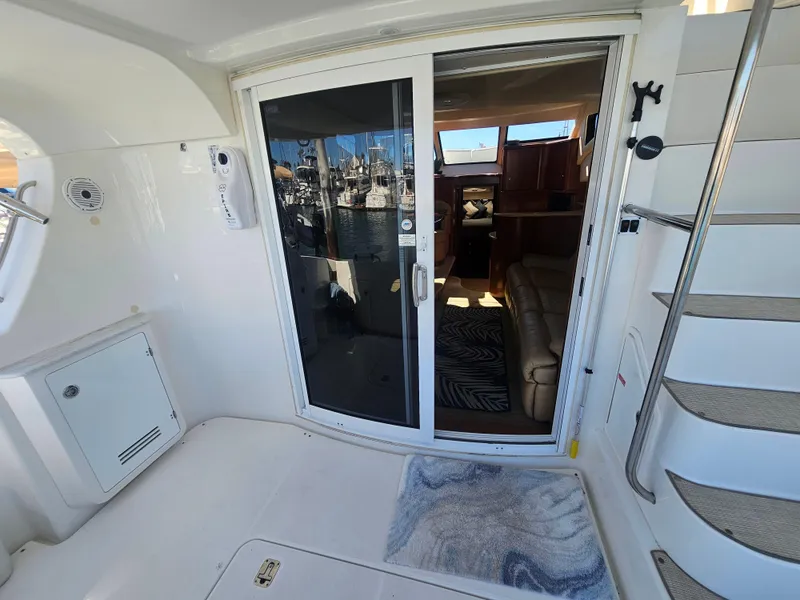 Slide: The Image of Interior view of 2012 Silverton West Coast Edition yacht with sliding glass door. - 32