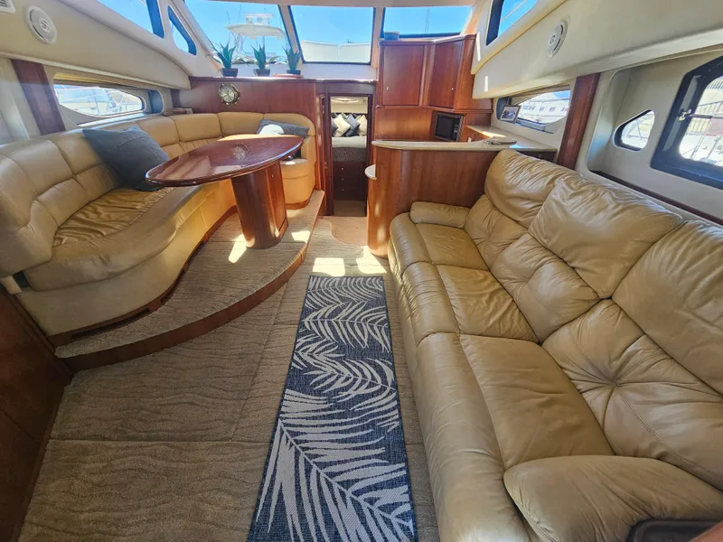 Slide: The Image of Luxurious interior of a 2012 Silverton West Coast Edition yacht with plush seating and elegant decor. - 33