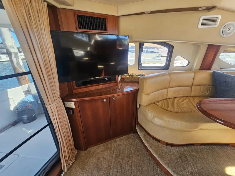 Slide: The Image of Interior of 2012 Silverton West Coast Edition yacht with TV and leather seating. - 34