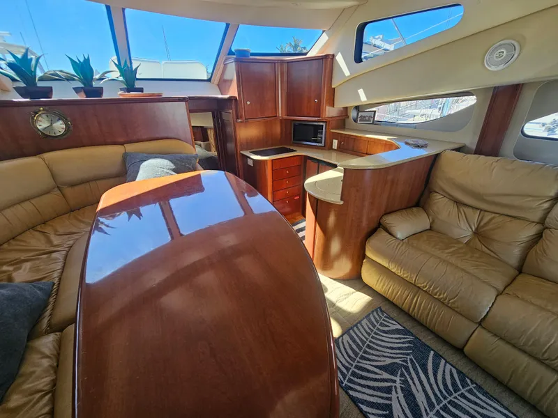 Slide: The Image of Luxurious interior of 2012 Silverton West Coast Edition yacht with leather seating and wooden finishes. - 40