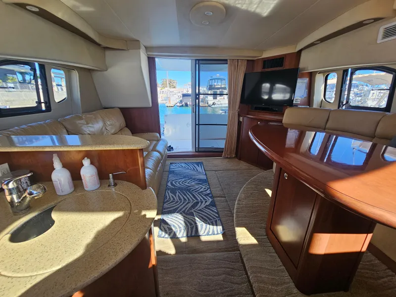 Slide: The Image of Luxurious 2012 Silverton West Coast Edition yacht interior with leather seating and modern amenities. - 45